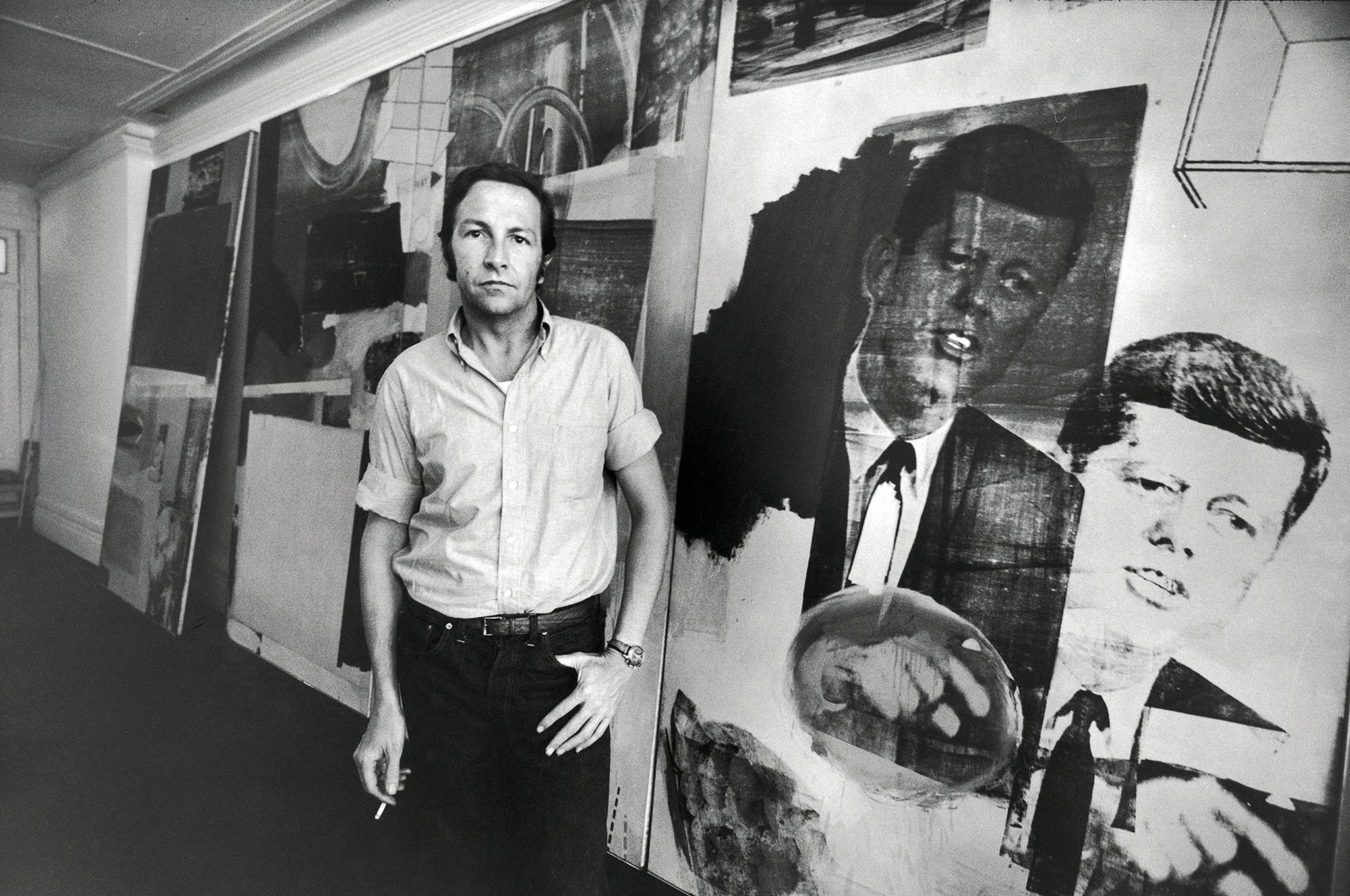 Robert Rauschenberg with his collage art